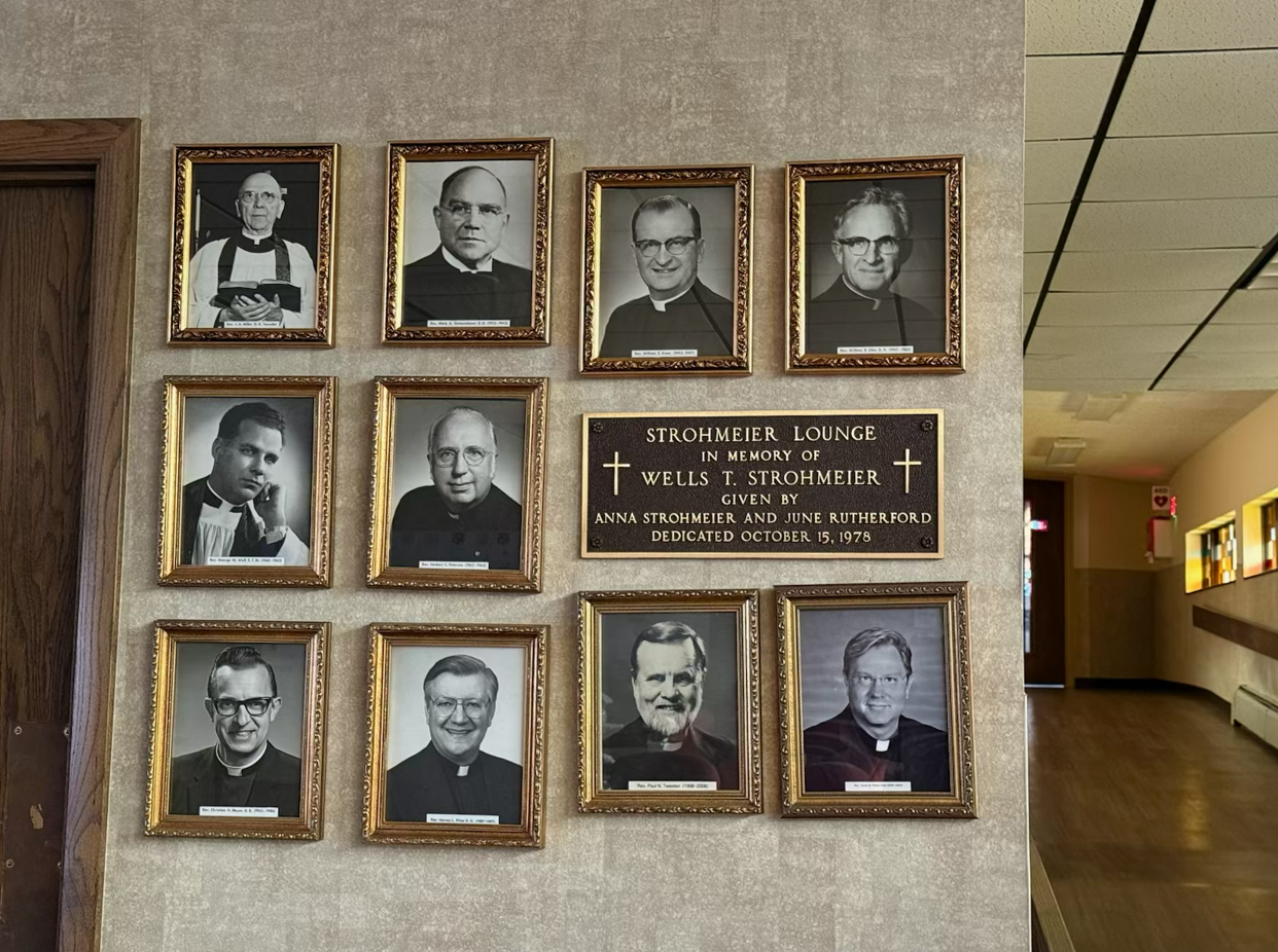 Portraits of the pastors who have served St. Mark, hanging in the Strohmeier Lounge